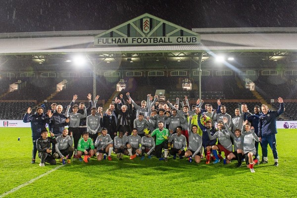 Gary Lineker with child refugees at Craven Cottage