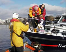 Woman and Dog being rescued by Chiswick Lifeboat Crew