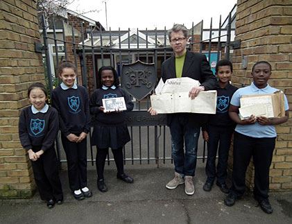 Pupils at St Peter's Primary in Hammersmith show off Victorian deeds