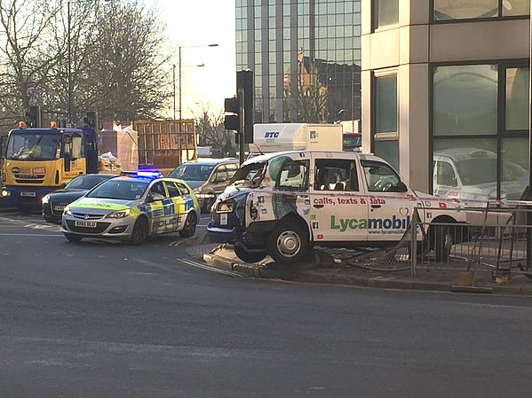 Taxi crashes through barrier in Hammersmith Broadway