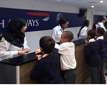 Children check in to KidZania London