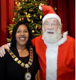 H&F Mayor Mercy Umeh with Santa at Christmas Day Lunch at Hammersmith Town Hall